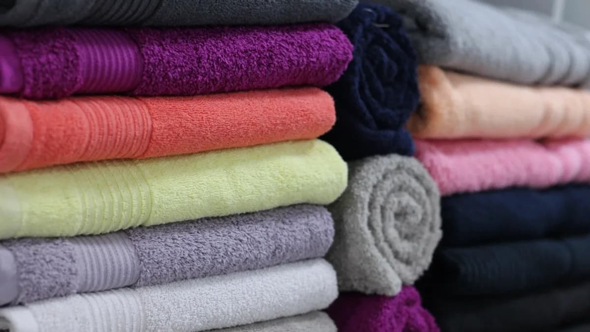 Stacks of freshly folded towels ready for housekeeping